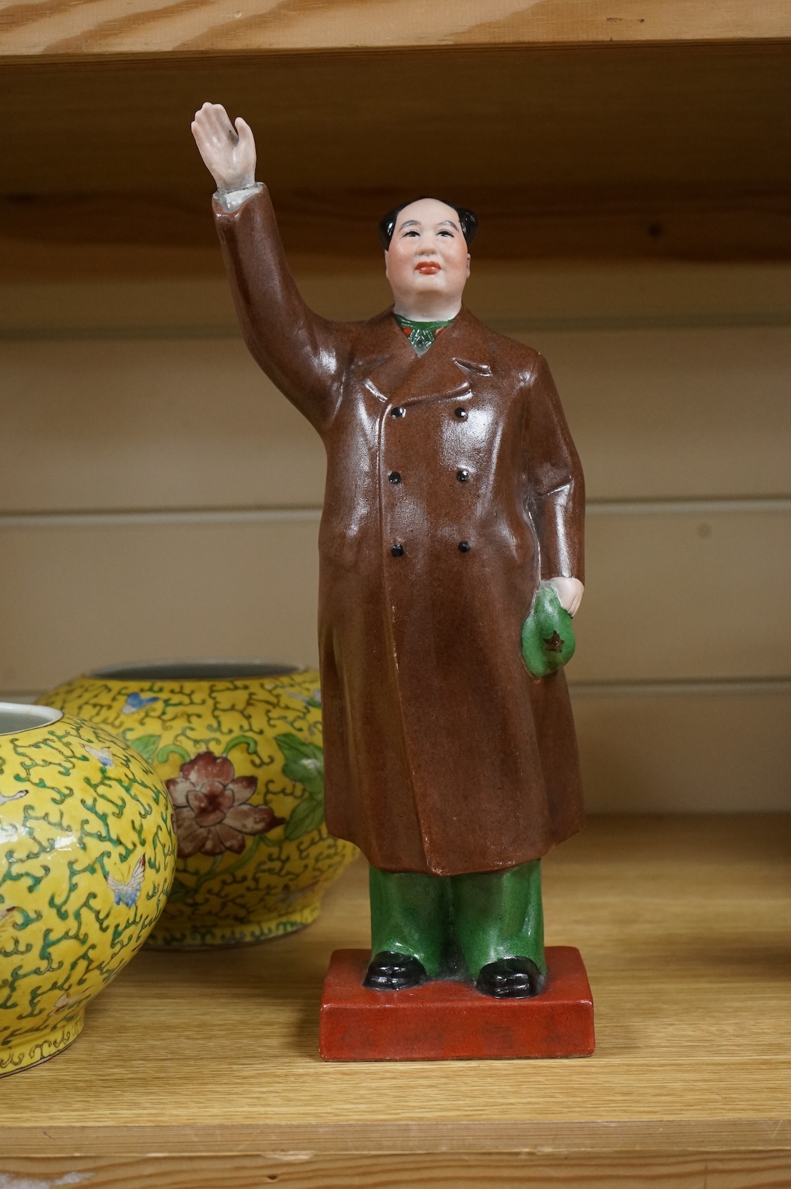 A Chairman Mao porcelain figure and a pair of Chinese yellow ground bowls decorated with flowers and insects, largest 30cm high